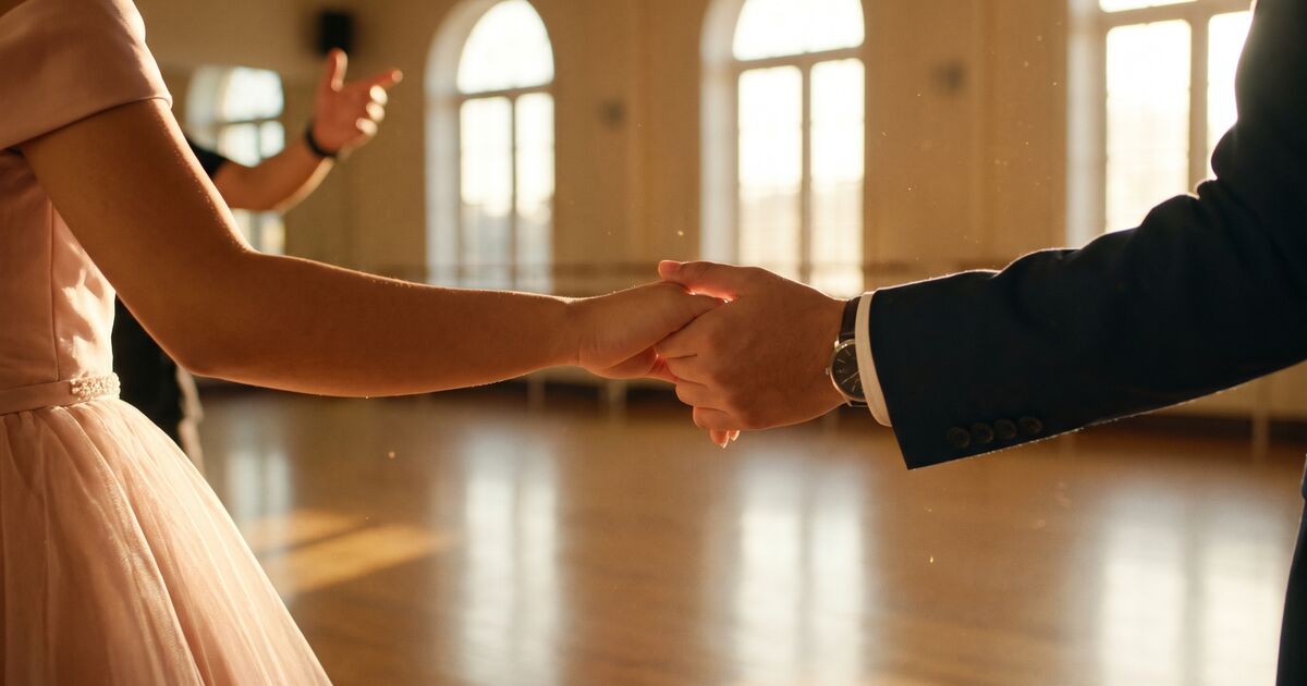 Paired dancers hands in formal hold position during a cotillion rehearsal, blush gown and dark suit in golden afternoon light